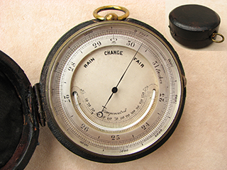 19th century pocket barometer with curved thermometer in case.